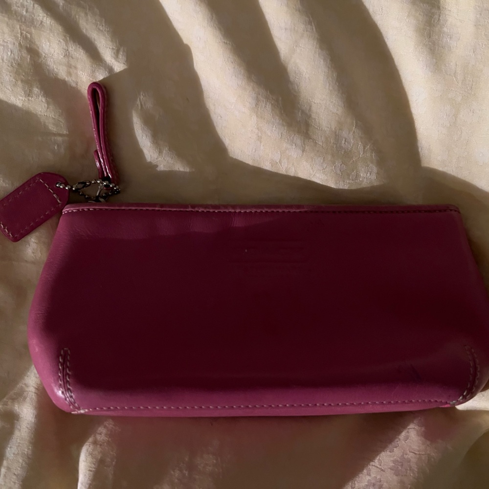 Coach pink leather make up bag with zip closure